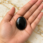 Black Agate gemstone held in hand