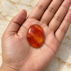 Carnelian gemstone held in hand