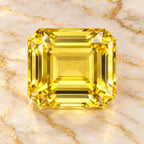 Lemon Topaz gemstone centered on warm marble