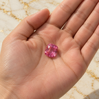 Pink Sapphire gemstone held in hand