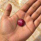 Ruby gemstone held in hand