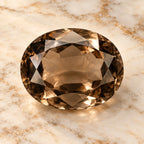 Smoky Quartz gemstone centered on warm marble