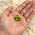 Sphene gemstone held in hand