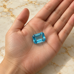 Topaz gemstone held in hand
