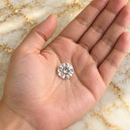 White Sapphire gemstone held in hand