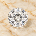 White Sapphire gemstone centered on warm marble
